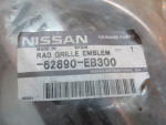 Эмблема для Nissan Navara 2005>, OEM 62890EB300 - вид 4 (фото)