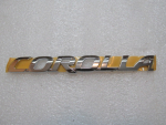 Эмблема для Toyota Corolla E15 2006-2013, OEM 75442-12A11 - вид 1 (фото)