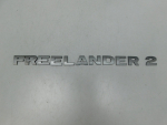 Эмблема для Land Rover Freelander II 2007>, OEM LR003859 - вид 1 (фото)
