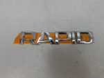 Эмблема для Skoda Rapid 2013-2020, OEM 5JA853687A2ZZ - вид 1 (фото)