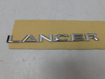 Эмблема для Mitsubishi Lancer 2007>, OEM 7415A112 - вид 1 (фото)