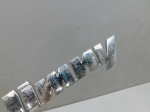 Эмблема для Suzuki Jimny IV 2018>, OEM 7783281A110PG - вид 2 (фото)